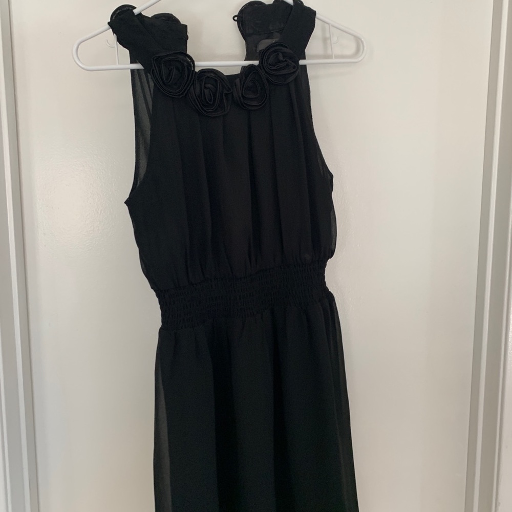 Woman’s black cocktail dress